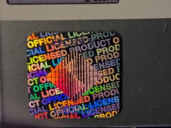 The PSP hologram design on a PS1 case, showing the SCE logo at a different angle